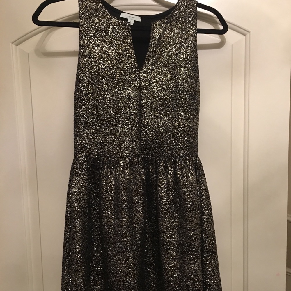 Black with gold speck dress.